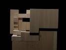 Photograph of bass wood cube model on basewith shifted portions of the cube.