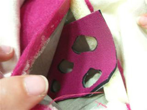 Top photo shows a piece of neoprene with holes cut in it, inserted inside the fabric pressure sensor “sandwich”; bottom photo shows the sensor placed at the bottom of the bag