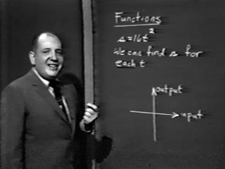 Image of Herb Gross in front of the chalkboard.