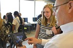 A photo of workshop participants looking at a camera readout.