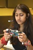 A photo of a girl holding a hand-built camera.